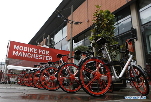 A row of Mobikes are seen in Manchester, Britain on June 29, 2017. Mobike, one of China's largest bike-sharing companies, launched its service in the Greater Manchester, Britain, on Thursday. (Xinhua/Craig Brough)