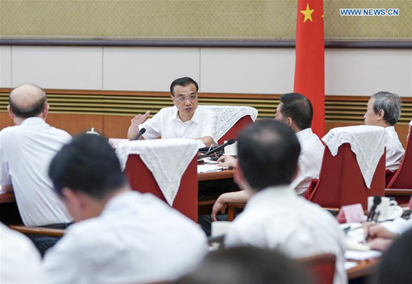 Chinese Premier Li Keqiang presides over a meeting with government officials and executives of leading manufacturers on manufacturing upgrades and economic restructuring in Beijing, capital of China, Aug. 25, 2017. (Xinhua/Xie Huanchi) 