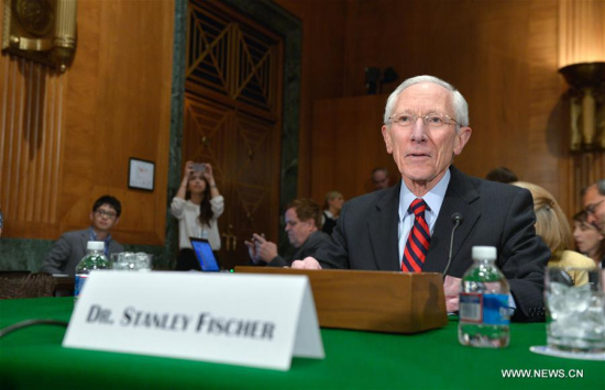 File photo taken on March 13, 2014 shows Stanley Fischer at a Senate Banking, Housing and Urban Affairs Committee hearing on the confirmation of him to be the vice chairman of the Federal Reserve, on Capitol Hill in Washington D.C., the United States. (Xinhua/Yin Bogu)