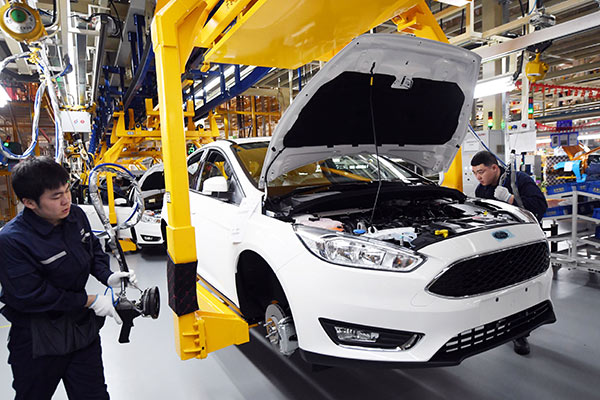 Workers assemble cars at a Changan Ford plant in Harbin, capital of Northeast China's Heilongjiang Province. (Photo provided to China Daily)