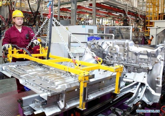 A staff worker works at the assembly line at the factory of Anqing branch of Anhui Jianghuai Automobile Group Corp., Ltd. in Anqing City, east China's Anhui Province, Oct. 30, 2017. (Xinhua file photo/Jiang Sheng)