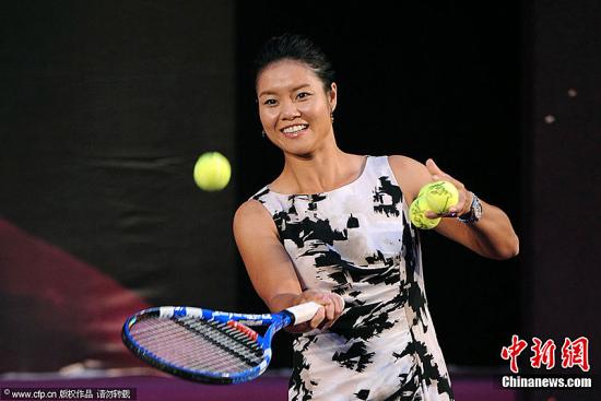 Li Na wore a stylish black and white dress to the 2011 French Open victory celebration held in Beijing on July 5. [Photo/CFP]