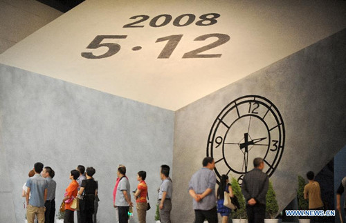 People visit the Wenchuan Earthquake Memorial Museum in the town of Qushan, Beichuan Qiang Autonomous County, southwest China's Sichuan Province, May 9, 2013. The museum was officially opened to the public for free on Thursday to commemorate the fifth anniversary of the Wenchuan earthquake, which hit Sichuan on May 12, 2008 and left more than 87,000 people dead or missing. (Xinhua/Xue Yubin) 