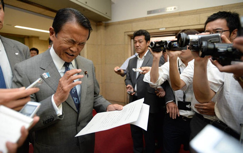 Japanese Deputy Prime Minister Taro Aso speaks at a press conference in Tokyo on Thursday morning 