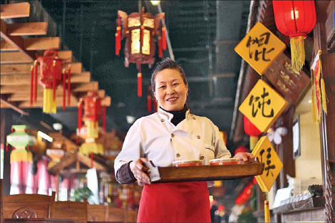 Hou Shuming runs a booth at Wan Feng Snacks. [Photo: Wang Jing / China Daily]