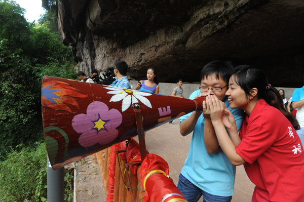 We are going to get married next year! a couple shouts through a loudspeaker at a celebration activity on Sunday for the upcoming Qixi Festival in Chongqing. Qixi Festival, a traditional day of romance in China, falls on the seventh day of the seventh l