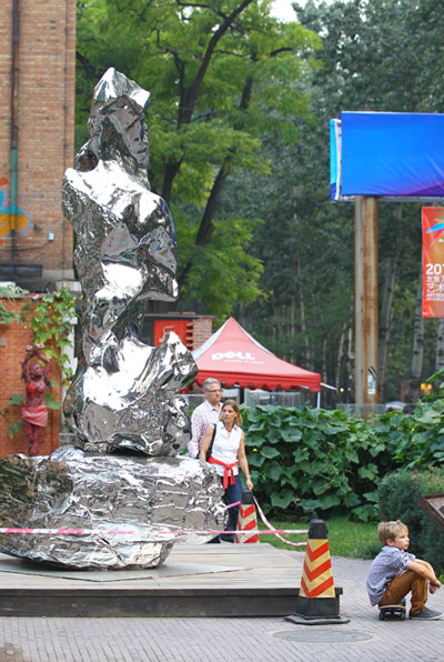 Zhan Wang's stainless steel rock sculpture stands on a roadside inside the 798 Art Zone.