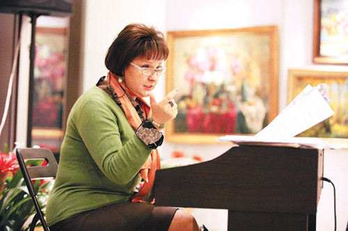 The Beijing Hand-to-Hand Chorus director and conductor Ekaterina Ilyakhina leads a rehearsal in Beijing. Photos by Wang Jing / China Daily