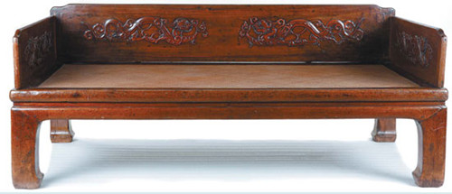 A luohan bed sculpted with dragon patterns from the early Qing Dynasty (1644-1911).