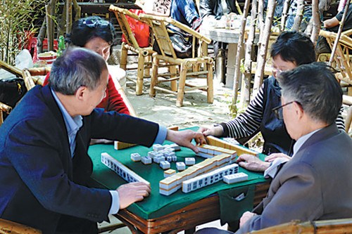 Visitors can indulge in some people-watching as locals play mahjong