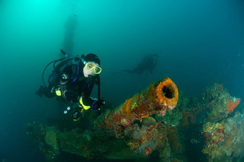 A diver explores a sunken wreck of World War II in the Republic of Palau. Photos by Yao Yi / For China Daily