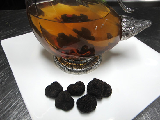 Thick slices of Chinese truffles are infused in Chinese wine and served as an aperitif to wake the taste buds. Photos by Guo Anfei / China Daily