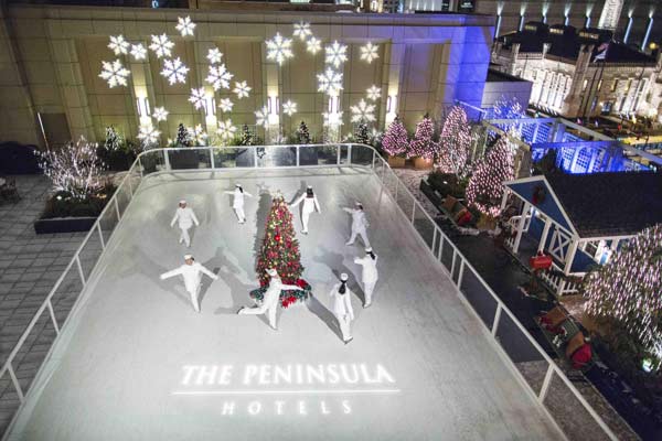 Surrounded by twinkling Christmas lights, The Peninsula Shanghai's skating rink is tucked into a pine tree winter wonderland and bathed in festive music. 