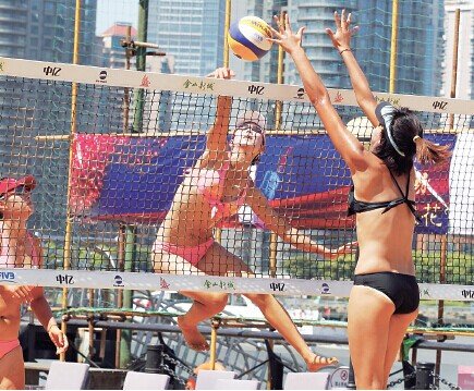 Beach volleyball is very popular at Bund Beach. 