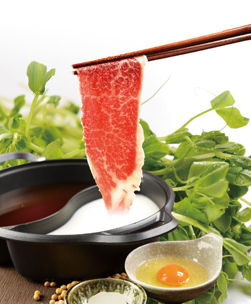 The raw egg dip offsets sukiyaki's sweet and salty edge. [Photo provided to China Daily]  