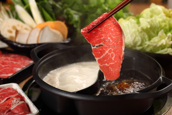 Japanese-style hotpot sukiyaki. [Photo provided to China Daily]  