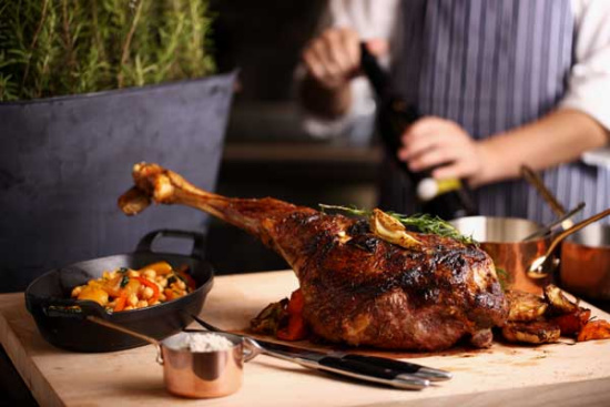 Chef Jarrod Verbiak prepares dishes at Bistrot B at Rosewood Hotel in Beijing. The new eatery in the capital features a variety of treats including the foie fras burger, a pate maison with artisanal mustard and the roast lamb shank. Photo provided to China Daily  