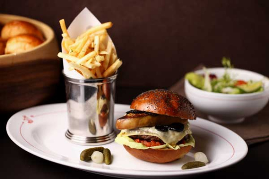 Bistrot B features a variety of treats including the foie fras burger, a pate maison with artisanal mustard and the roast lamb shank. Photo provided to China Daily  