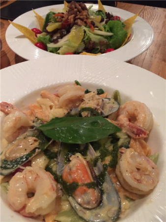 Lighter fare includes seafood pasta and artful salads. (Mike Peters/China Daily)