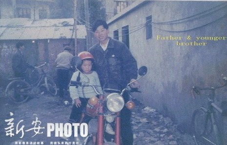 Li Xuwen and his younger son, who looks like his missing elder brother, Li Xiang