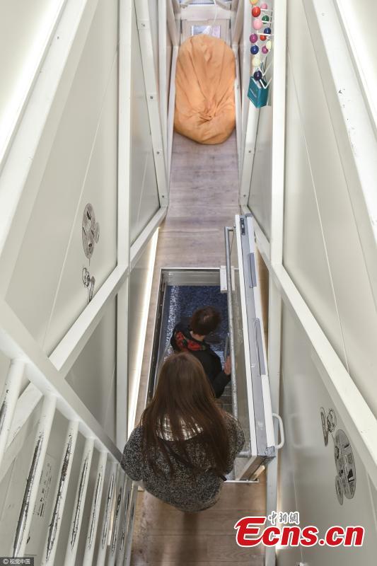 People visit the Keret House in Warsaw, Poland. Regarded as the narrowest house in the world, the building measures 152 cm at its widest point and 92 cm at its most narrow. Keret House was designed by Jakub Szczesny, and named after the first tenant of the building, Israeli filmmaker and writer Etgar Keret. Although the Keret House is being used as a residence, the house is classified as an “art installation” because it does not meet the building norms of the country. (Photo/CFP)