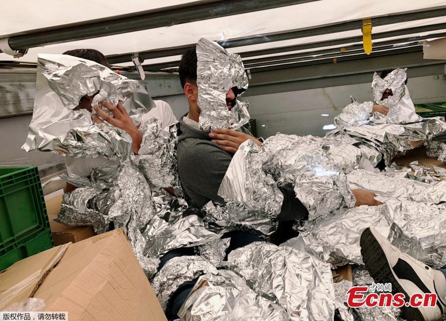 Photo taken on June 6, 2018 shows customs enforcement officers in Istanbul’s Pendik port have caught undocumented migrants, wrapped in aluminum foil to hide from x-ray detectors, on an 18-wheel truck en route to Italy. (Photo/Agencies)