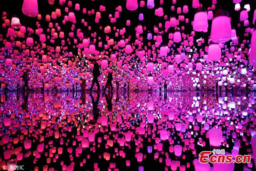 The flower-filled waterfall is the work of Japanese collective teamLab, known internationally for their innovative \