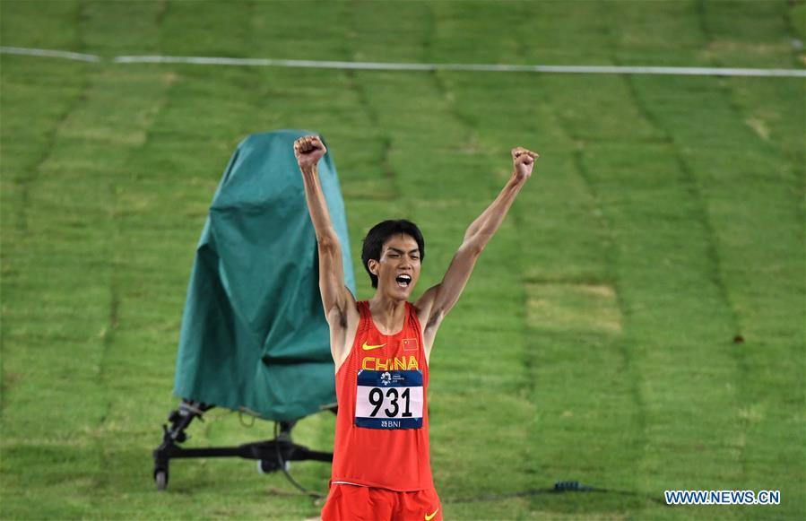 Wang Yu of China celebrates after the men\'s high jump final of athletics at the Asian Games 2018 in Jakarta, Indonesia on Aug. 27, 2018. (Xinhua/Du Yu)