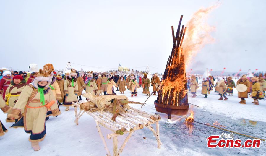 Local Oroqen hold the fifth Ice and Snow Yisaren Ritual, a grand gathering, in Oroqen Autonomous Banner, Hulunbuir City, North China\'s Inner Mongolia Autonomous Region, Dec. 26, 2018. People worship nature and totem spirits and also participate in various folk sports. (Photo: China News Service/Hou Yupeng)