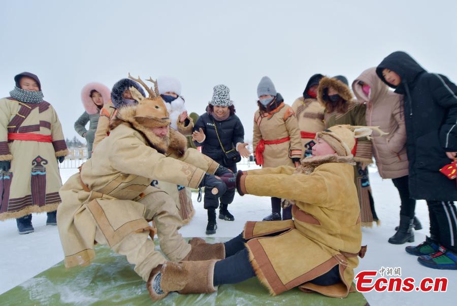 Local Oroqen hold the fifth Ice and Snow Yisaren Ritual, a grand gathering, in Oroqen Autonomous Banner, Hulunbuir City, North China\'s Inner Mongolia Autonomous Region, Dec. 26, 2018. People worship nature and totem spirits and also participate in various folk sports. (Photo: China News Service/Hou Yupeng)