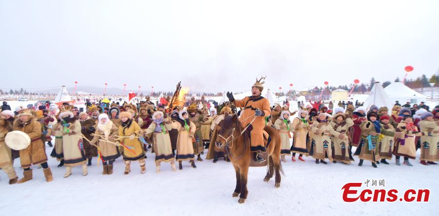 Local Oroqen hold the fifth Ice and Snow Yisaren Ritual, a grand gathering, in Oroqen Autonomous Banner, Hulunbuir City, North China\'s Inner Mongolia Autonomous Region, Dec. 26, 2018. People worship nature and totem spirits and also participate in various folk sports. (Photo: China News Service/Hou Yupeng)