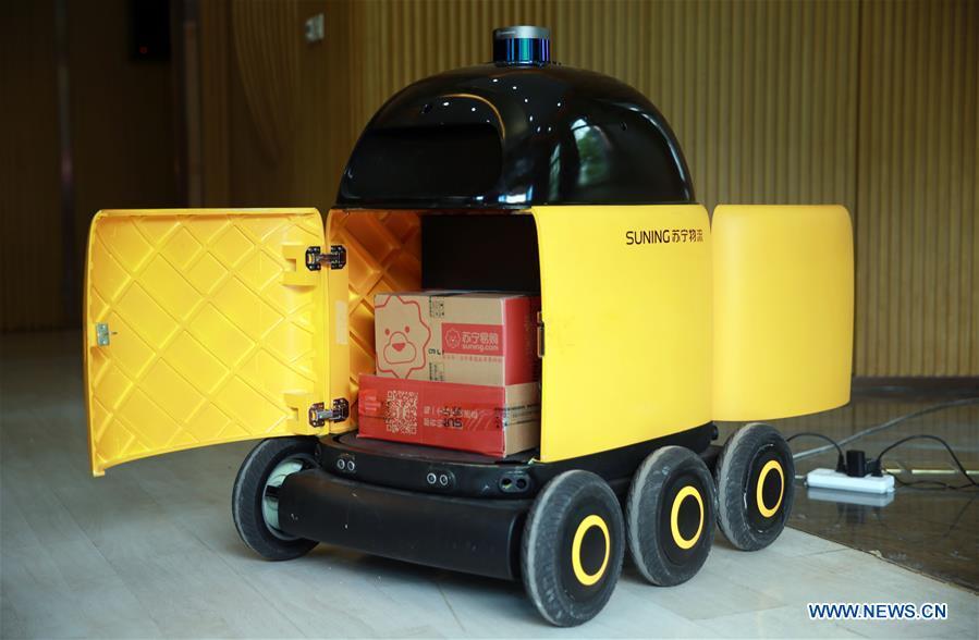 Photo taken on April 16, 2018 shows an unmanned delivery car at a pilot community in Nanjing, capital of east China\'s Jiangsu Province. China\'s express delivery sector handled 50.5 billion parcels in 2018, up 25.8 percent year on year, data from the State Post Bureau (SPB) showed. Gross business revenue of the sector increased 21.2 percent year on year to hit 601 billion yuan (about 88 billion U.S. dollars) last year, according to the SPB. (Xinhua/Li Yuze)