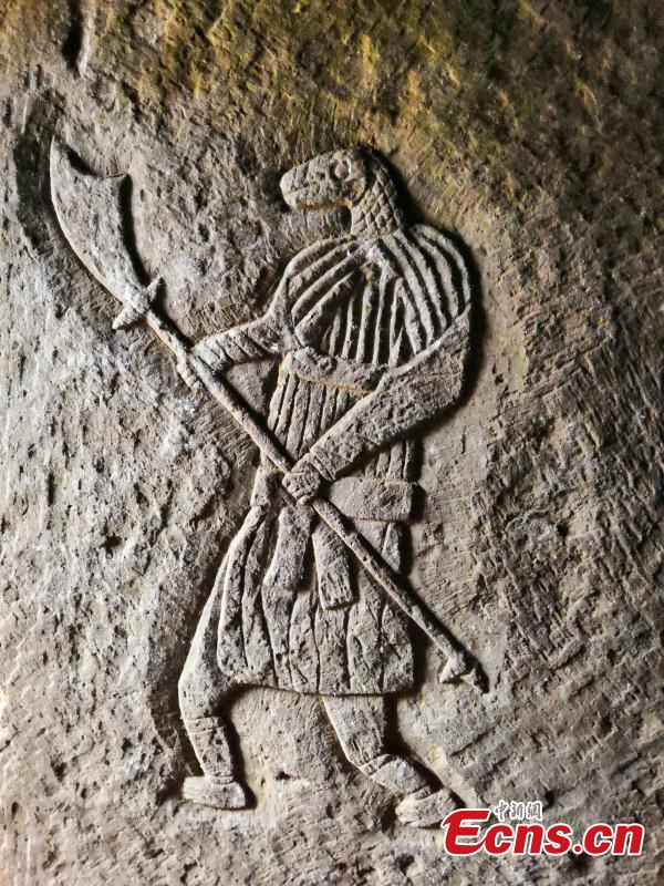 A close-up of a stone carving found at tomb from the Song Dynasty (960-1279) at Cili Village, Zheng\'an County, Southwest China\'s Guizhou Province. Experts from the Guizhou Provincial Institute of Cultural Relics and Archaeology found a large number of elaborate stone carvings of figures with human bodies and snake or mouse heads at two tombs dating back to the Song Dynasty. Other carvings feature animals and plants thought to be auspicious in Chinese culture. (Photo: China News Service/Min Kai)