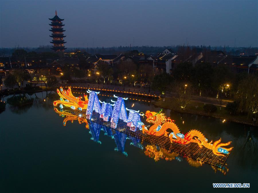 Aerial photo taken on Jan. 28, 2019 shows the dragon and phoenix lanterns installed in Wuzhen, east China\'s Zhejiang Province. A local lantern festival, presenting over 330 lanterns, was held here before the Spring Festival, or the Chinese Lunar New Year, which falls on Feb. 5 this year. (Xinhua/Xu Yu)