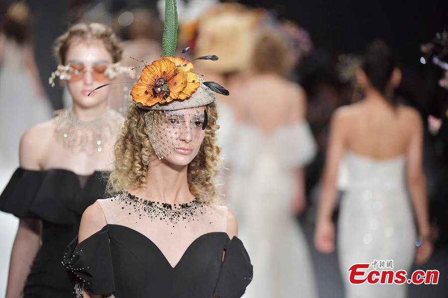 A model wears a creation by brand She\'s during the 2019 Shenzhen Fashion Week in Shenzhen City, South China’s Guangdong Province, March 17, 2019. (Photo: China News Service/Chen Wen)