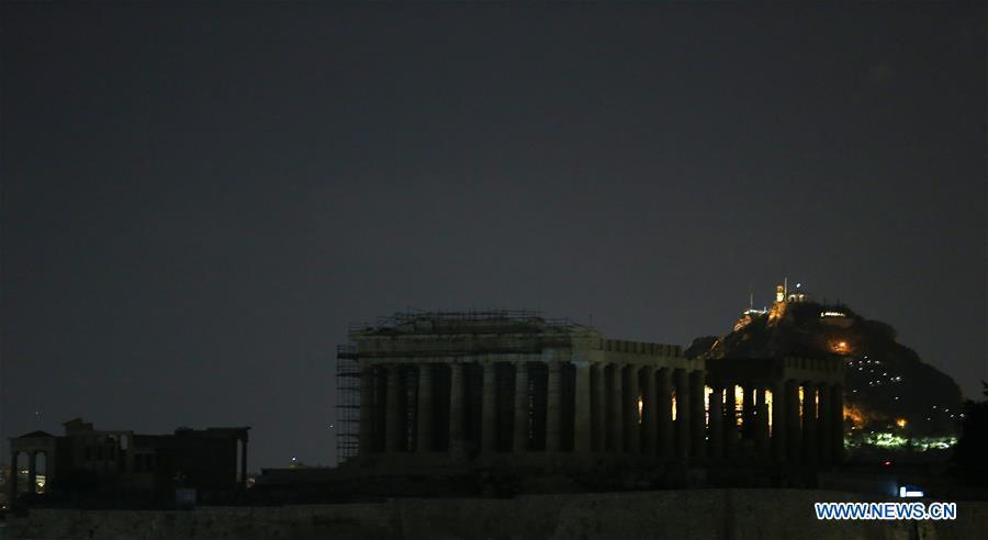 Photo taken on March 30, 2019 shows the lights off of the Parthenon temple during the Earth Hour event in Athens, Greece. Several landmarks across Greece went dark on Saturday, joining global efforts to raise awareness about climate change to save the planet. Earth Hour is a global initiative first launched by World Wildlife Fund (WWF) in 2007 and soon became a popular movement worldwide. (Xinhua/Marios Lolos)