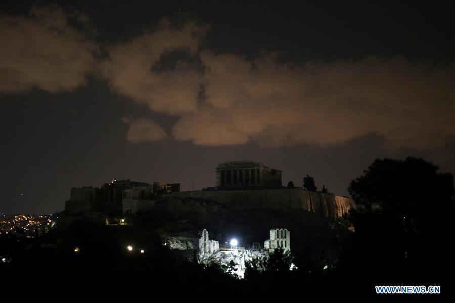 Photo taken on March 30, 2019 shows the lights off of the Acropolis during the Earth Hour event in Athens, Greece. Several landmarks across Greece went dark on Saturday, joining global efforts to raise awareness about climate change to save the planet. Earth Hour is a global initiative first launched by World Wildlife Fund (WWF) in 2007 and soon became a popular movement worldwide. (Xinhua/Marios Lolos)