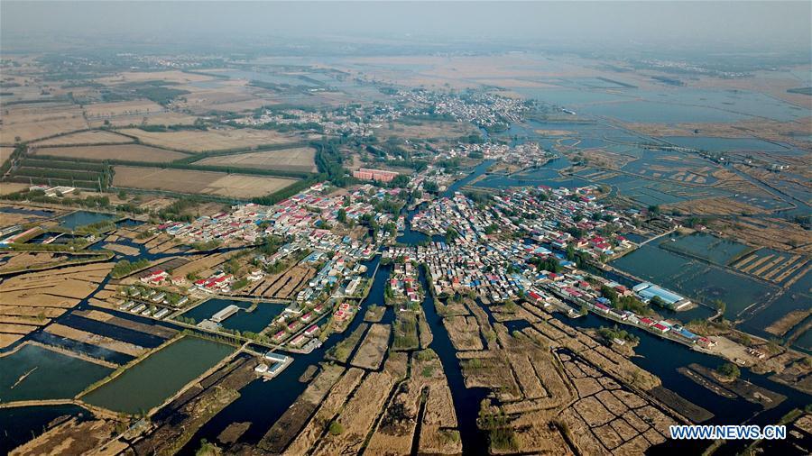 Aerial photo taken on April 10, 2019 shows the Zhaozhuangzi Village of Anxin County in Xiongan New Area, north China\'s Hebei Province. Restoration work has started in Baiyangdian Lake, northern China\'s largest freshwater body. High-pollution and energy-intensive production has been tackled. As a result, water quality has improved remarkably. (Xinhua/Mu Yu)
