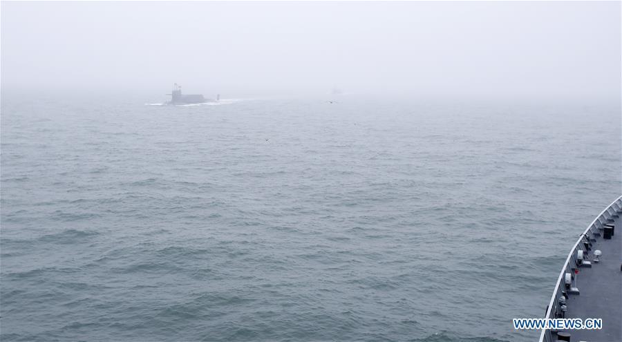 A new type of nuclear submarine of the Chinese People\'s Liberation Army (PLA) Navy is reviewed during a naval parade staged to mark the 70th founding anniversary of the PLA Navy on the sea off Qingdao, east China\'s Shandong Province, on April 23, 2019. (Xinhua/Li Gang)