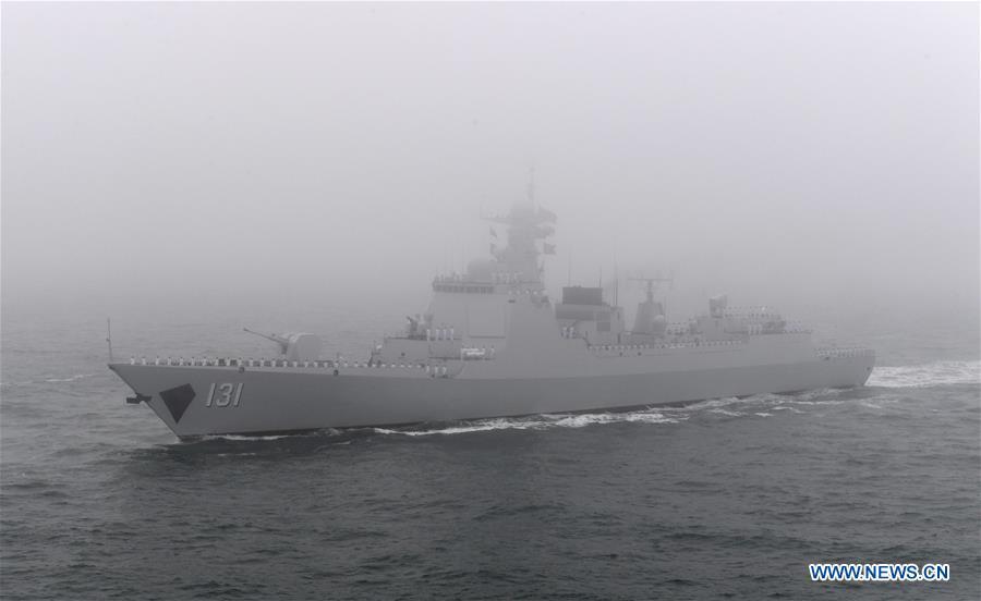 The guided-missile destroyer Taiyuan of the Chinese People\'s Liberation Army (PLA) Navy is reviewed during a naval parade staged to mark the 70th founding anniversary of the PLA Navy on the sea off Qingdao, east China\'s Shandong Province, on April 23, 2019. (Xinhua/Li Ziheng)