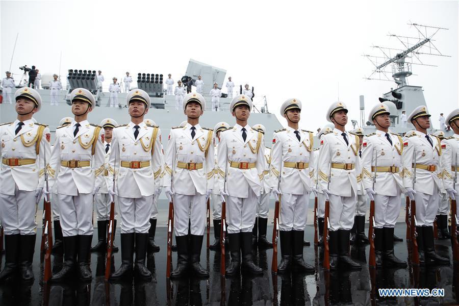 The honor guards of the Chinese People\'s Liberation Army (PLA) Navy stand in formation before a naval parade staged to mark the 70th founding anniversary of the PLA Navy at a pier in Qingdao, east China\'s Shandong Province, on April 23, 2019. (Xinhua/Li Gang)