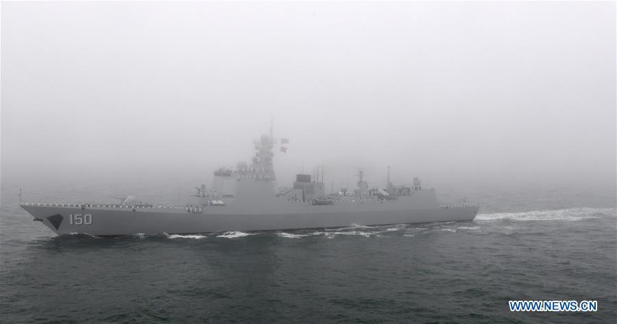 The guided-missile destroyer Changchun of the Chinese People\'s Liberation Army (PLA) Navy is reviewed during a naval parade staged to mark the 70th founding anniversary of the PLA Navy on the sea off Qingdao, east China\'s Shandong Province, on April 23, 2019. (Xinhua/Li Ziheng)