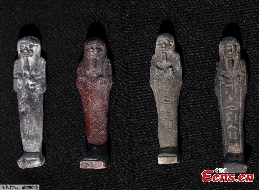 Recovered Shabits, mummy-liked statues, are presented to the media by the National Museum during a news conference in Rio de Janeiro, Brazil, Tuesday, May 7, 2019. Brazil\'s national museum said Tuesday it has recovered 200 pieces from its 700 pieces Egypt collection, the largest in Latin America, after a devastating fire in September 2018.