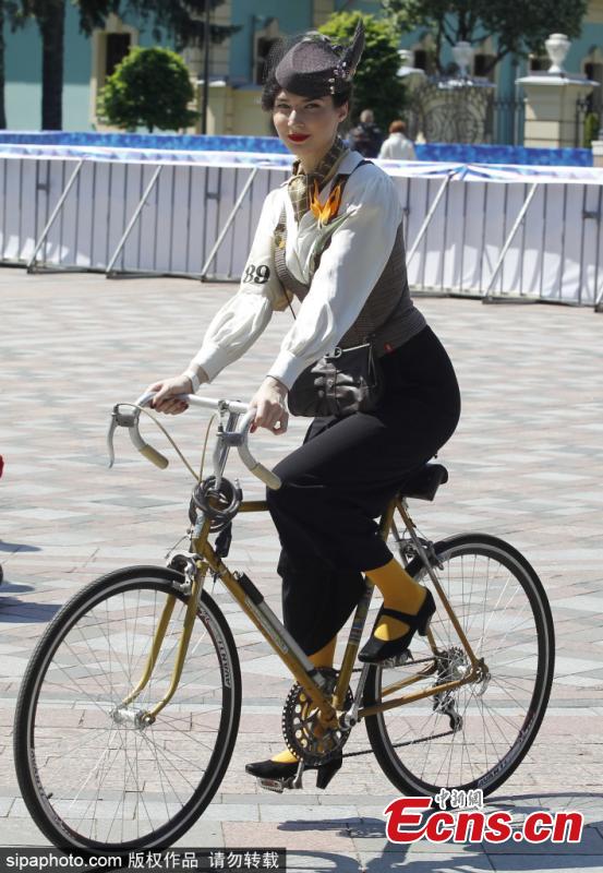 Participants with their bikes wearing vintage clothes attend Retro Cruise 2019, a retro parade on bicycles, similar of the known Tweed Run bike ride, in center of Kiev, Ukraine, on 19 May 2019.(Photo/Sipaphoto)