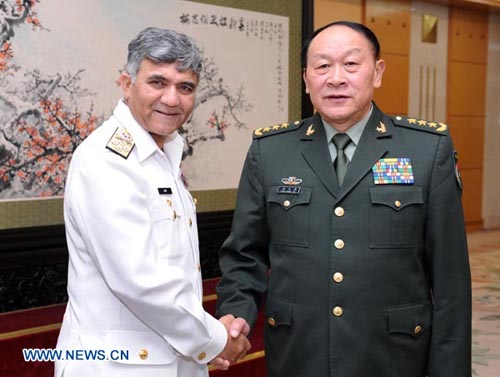 Chinese State Councilor and Defense Minister Liang Guanglie (R) shakes hands with Pakistani Chief of the Naval Staff Muhammad Asif Sandila in Beijing, capital of China, April 25, 2012. (Xinhua/Xie Huanchi)