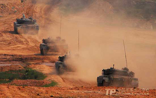 An armored assault group of an armored regiment under the Nanjing Military Area Command of the PLA conducts combat drill. [China Military Online]