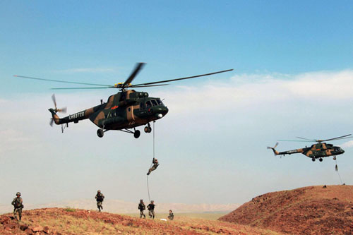 Photo taken on June 14, 2012 show the combat practice scene of the Peace Mission 2012 joint anti-terrorism military exercise in Khujand, Tajikstan.[Photo/Xinhua]