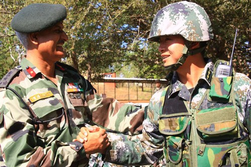 An Indian general greets a Chinese solider in the Hand-in-Hand Sino-Indian joint exercise in Belgaum, southwest India, in December 2008. Li Gang / Xinhua