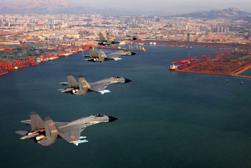 Four fighter planes with the Jinan Military Command Area fly in formation during a training exercise on Sunday. CUI WENBIN / FOR CHINA DAILY