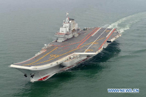 Photo taken in May 2012 shows a Chinese aircraft carrier cruising for a test on the sea. China's first aircraft carrier was delivered and commissioned to the Navy of the Chinese People's Liberation Army on Sept. 25, 2012. The carrier, with the name Liaoning and hull number 16, was officially handed over to the Navy at a ceremony held in a naval base of northeast China's Dalian Port. (Xinhua/Li Tang)